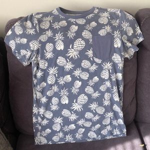 Charles and a half pale blue T-shirt with white pineapple